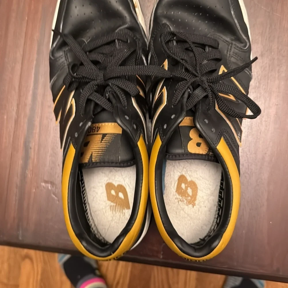 New Balance men’s black and gold/tan sneakers size 12